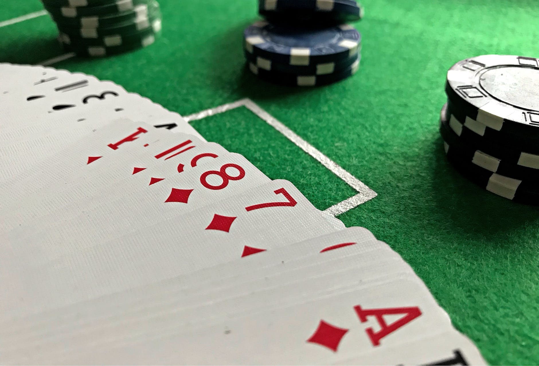 deck of playing cards with poker chips